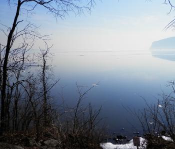 Southern Hudson River view from Teller's Point at Croton Point Park. Too hazy to see bridge.