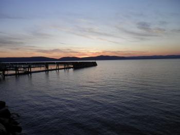 Sunset at empty docks along Hudson River.